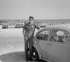 Photograph: [David Lewis Posing with a Volkswagen]