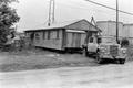 Photograph: [Photograph of a House Being Moved]
