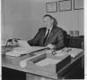 Photograph: C.A. Roberson at His Desk