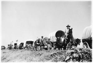 Primary view of object titled 'Texas Sesquicentennial Wagon Train on the Way to Robstown'.