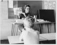 Photograph: Children's Center Instructor Reading to Her Class