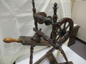 Primary view of object titled '[Late 18th century Irish spinning wheel, upright, from the side]'.