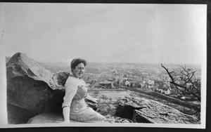 Primary view of object titled '[Photograph of Woman Sitting on West Mountain]'.