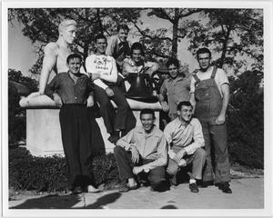 Primary view of object titled '[Students posing with "The Student" sculpture]'.