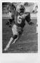 Photograph: [Malcolm Jones Carrying the Football]