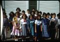 Photograph: [Photograph of Children in Front of a White Building]