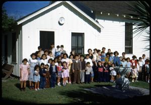 Primary view of object titled '[Photograph of Children in Front of Iglesia Presbiteriana Mexicana]'.