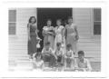 Photograph: [Group of Hispanic Women and Children on a Porch]
