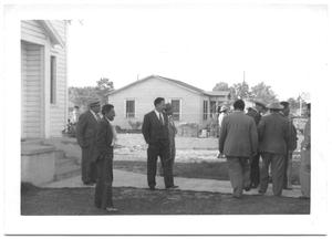 Primary view of object titled '[Men Visiting Outside of Church after Meeting]'.