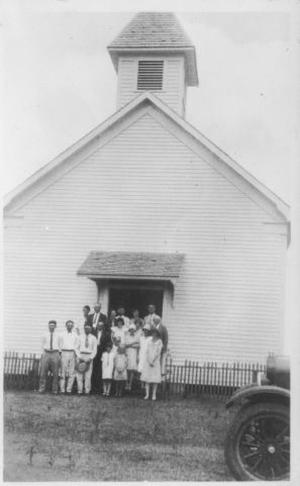 Primary view of object titled '[A group of people in front of a (German Baptist) church.]'.