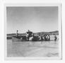Photograph: [Men Offloading Supplies From a Dinghy]