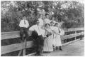 Primary view of [Young people visiting on a country bridge]