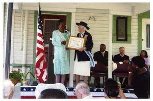 Primary view of object titled 'Ernestine Thompson receiving community service award from D.A.R.'.