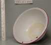 Primary view of [White enameled bowl with 7/8 lip trimmed with red.]