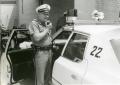 Primary view of [Arlington Police Officer Bill Taylor speaking over mobile radio, ca. 1965, view 1]