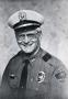 Photograph: [Arlington Police Officer Ed Watson's portrait, early 1980s]