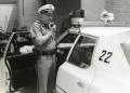 Primary view of [Arlington Police Officer Bill Taylor speaking over mobile radio, ca. 1965, view 2]