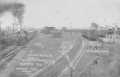 Thumbnail image of item number 1 in: '[Railroad Yard in Rosenberg, train approaching to the left]'.
