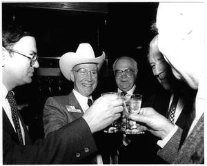Primary view of object titled '[Jim Wright toasting with Martin Frost and others]'.