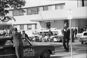 Primary view of object titled '[John F. Kennedy's hearse leaving Parkland Hospital]'.