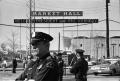 Photograph: [Dallas Police officers standing guard at the Dallas Trade Mart]
