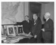 Thumbnail image of item number 1 in: '[George A. Hill, Jr. showing a place in Texas on geologic U.S. map to two unidentified men]'.