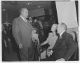 Photograph: [Tom Miller with unidentified men and women at Austin National Bank]