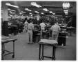 Photograph: [Men working in shop at Austin American-Statesman]
