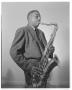 Photograph: [A photograph of a musician playing a tenor saxophone]