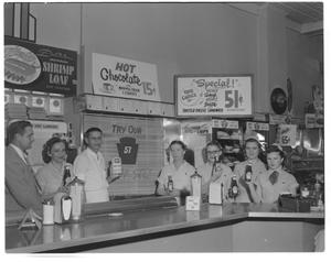 Primary view of object titled '[Restaurant Employees Displaying Heinz Products]'.