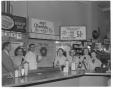 Photograph: [Restaurant Employees Displaying Heinz Products]