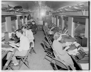 Primary view of object titled '[Newspress inside train]'.