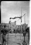 Photograph: [Pole vaulter clearing the bar]