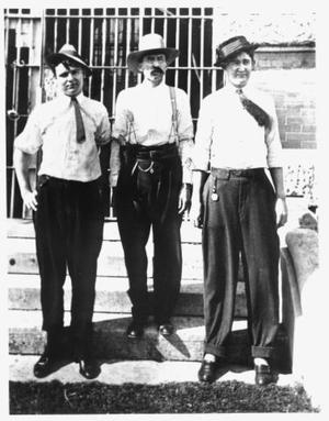 Primary view of object titled '[Three men (possibly H.M. Shannon), Sheriff M.L. Woolley, and Deputy Dink Hagan]'.