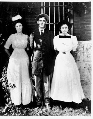 Primary view of object titled '[Sheriff M.L. Woolley's three oldest children standing outside Richmond jail]'.