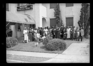 Primary view of object titled '[Photograph of a Group of People Outside Boykins Funeral Home]'.