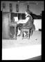 Primary view of [Photograph of a Woman Playing the Piano]