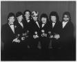 Primary view of [Photograph of the Band Members of Toto Holding Grammy Awards]