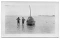 Photograph: [Two Men and Small Boat]