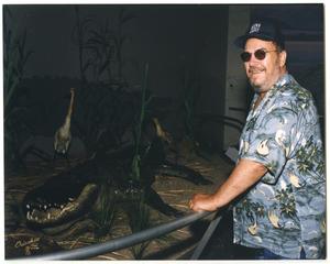 Primary view of object titled '[Photograph of Bobby Charles Near Alligator]'.