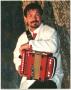 Photograph: [Photograph of Jo-El Sonnier with a Red Accordion]