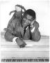 Photograph: [Portrait of Clarence Henry with a Stuffed Frog]