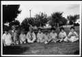 Photograph: [Nine children seated on lawn of Dyer Moore residence]