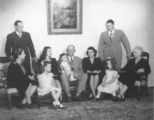 Primary view of object titled '[John M. Moore, Jr. Family in the Moore home]'.