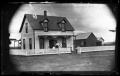Primary view of [Clapboard house with barn]