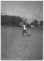 Primary view of [Photograph of a Boy Catching a Football]