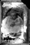 Photograph: [Baby in a white gown]