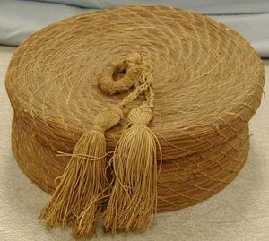 Primary view of object titled 'basket with woven tassels on top'.