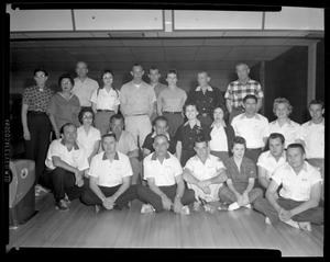 Primary view of object titled '[League of bowlers pose at bowling alley]'.