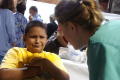 Primary view of [Student looks distressed during a health screening at a back to school fair]